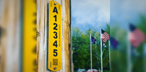 Yellow Telephone Utility Pole Tag Mounted on Pole