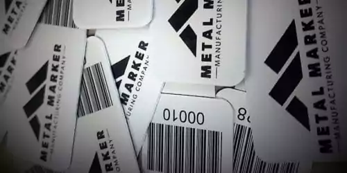 Pile of Metal Marker Barcode Quickpull Tags