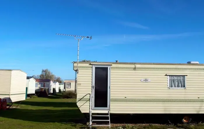 A trailer house with Mobile Home Data Plate