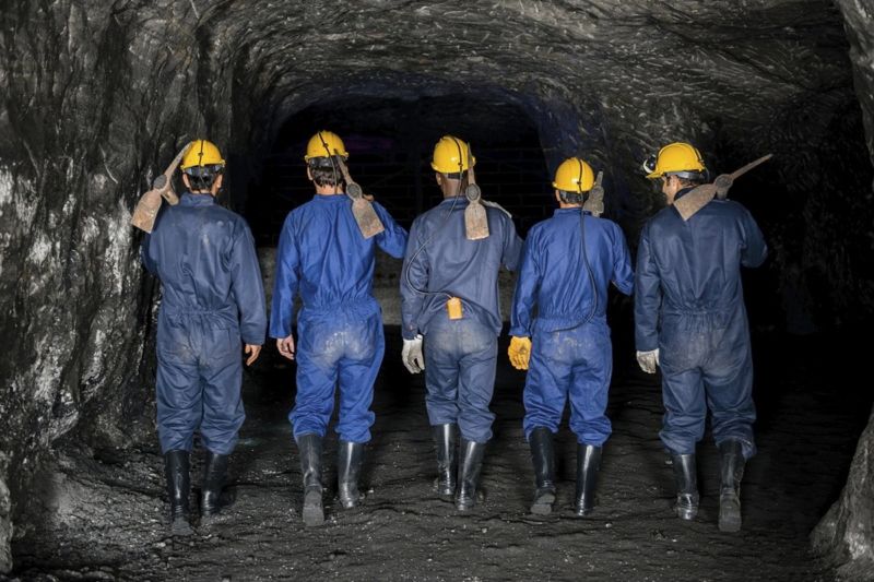Miners going inside the mining field